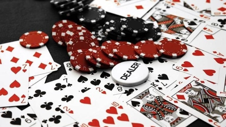 Live AduQ dealer at prima77 login table with cards and chips